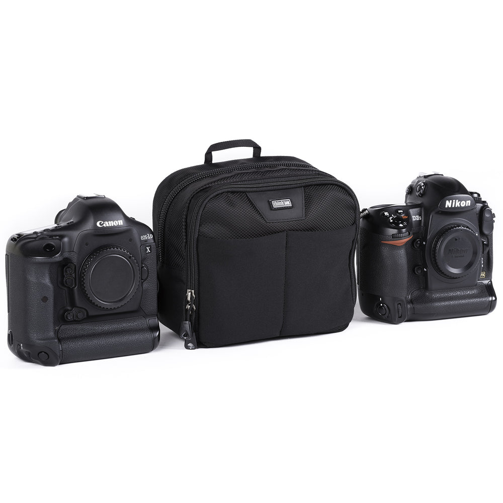 Utility bag for diverse carry options: most gripped DSLRs, 1–2 small lenses or 2 camera GoPro Kit